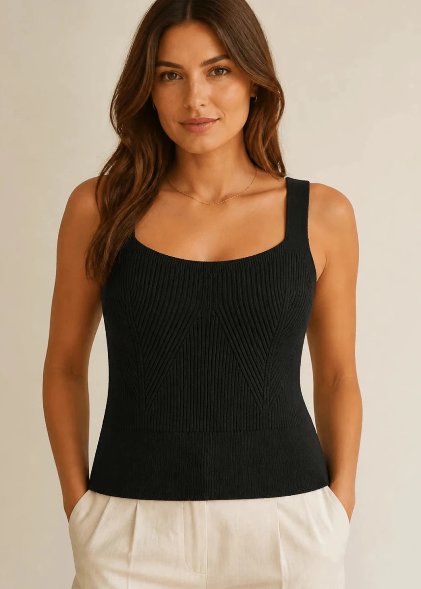 Model wearing the ELLY black chevron ribbed knit top with a structured square neckline.
