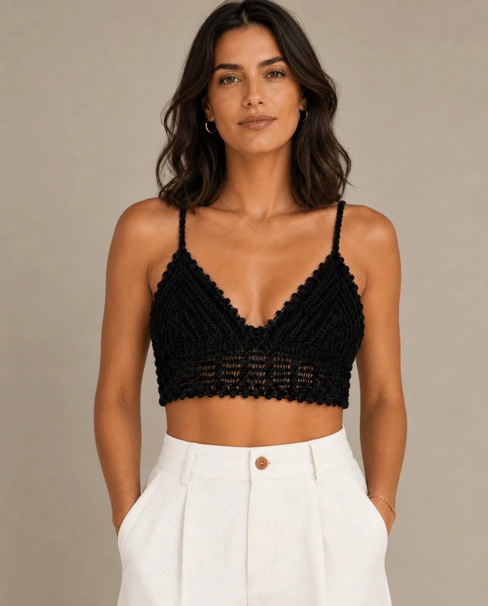 Model wearing the ELLY black crochet triangle bralette top with scalloped openwork detailing.