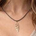 Rhodium coated brass pendant on a metallic string - ELLY
