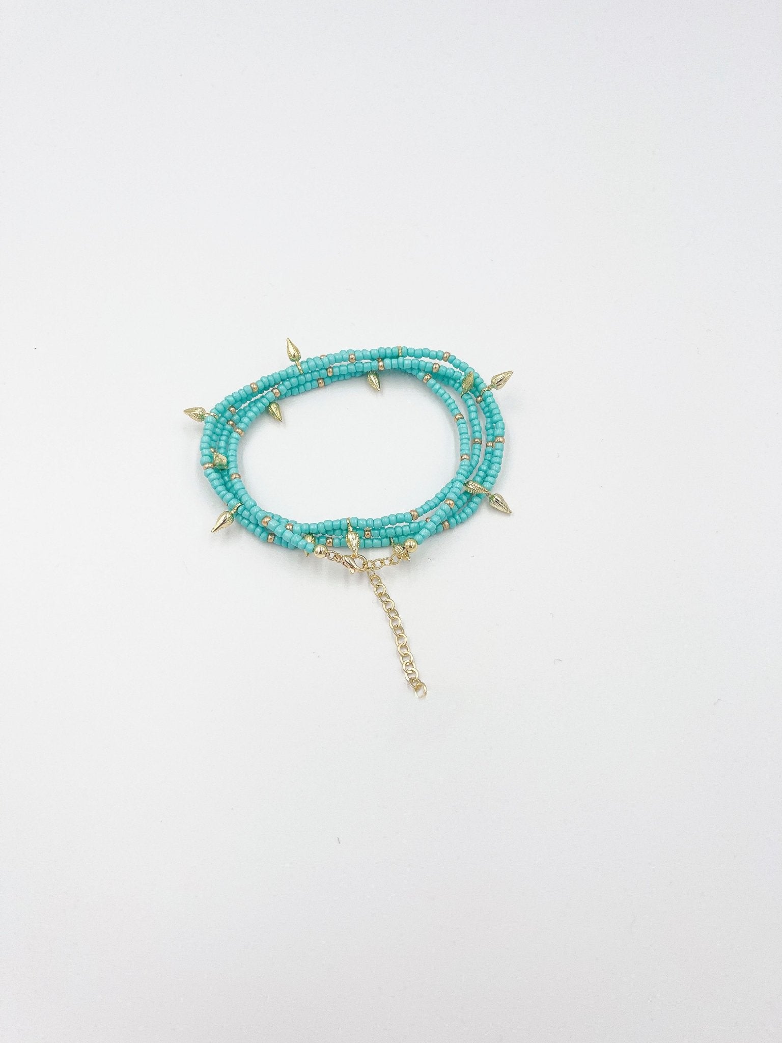 Beads necklace featuring 18 karat gold plated ornaments that can be styled as a bracelet or belt. - ELLY