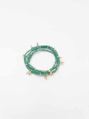 Beads necklace featuring 18 karat gold plated ornaments that can be styled as a bracelet or belt. - ELLY